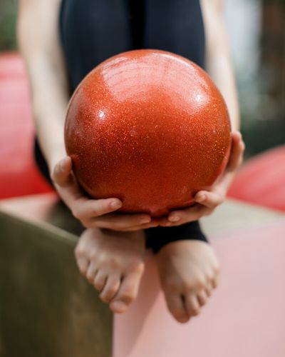 Close-up of hands and feet during a simple balance exercise.